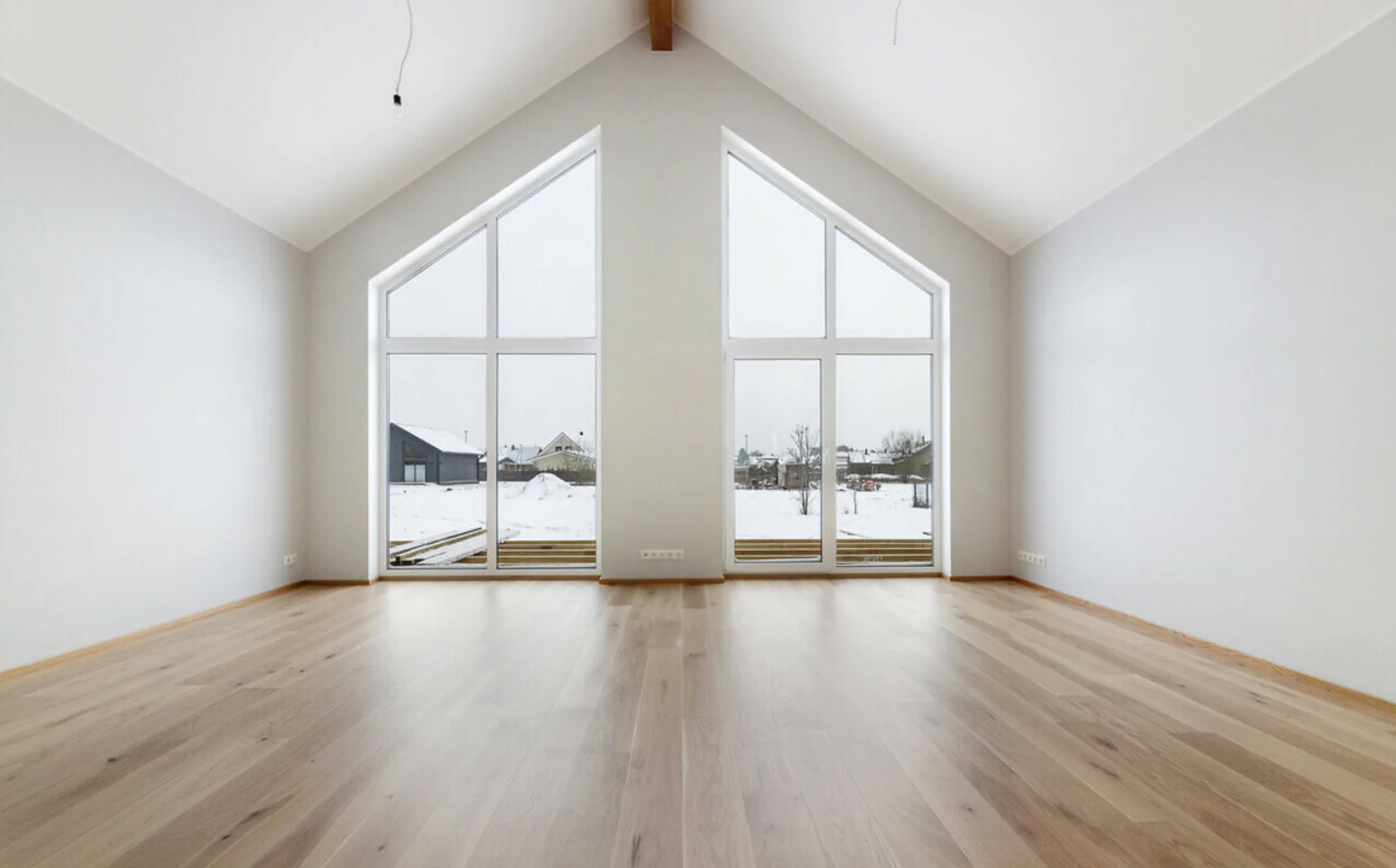 Big windows in a nice living room.