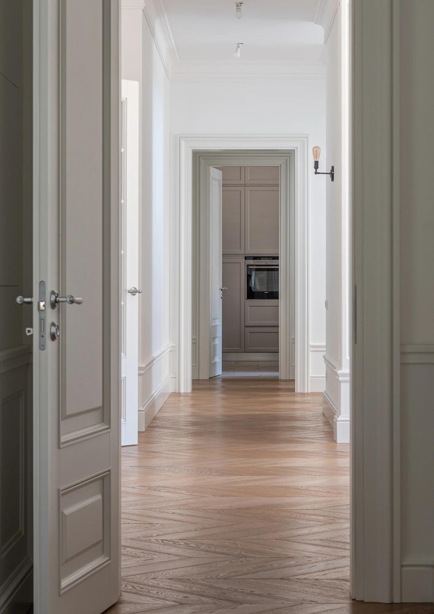 Luxurious hallway with wooden flooring.