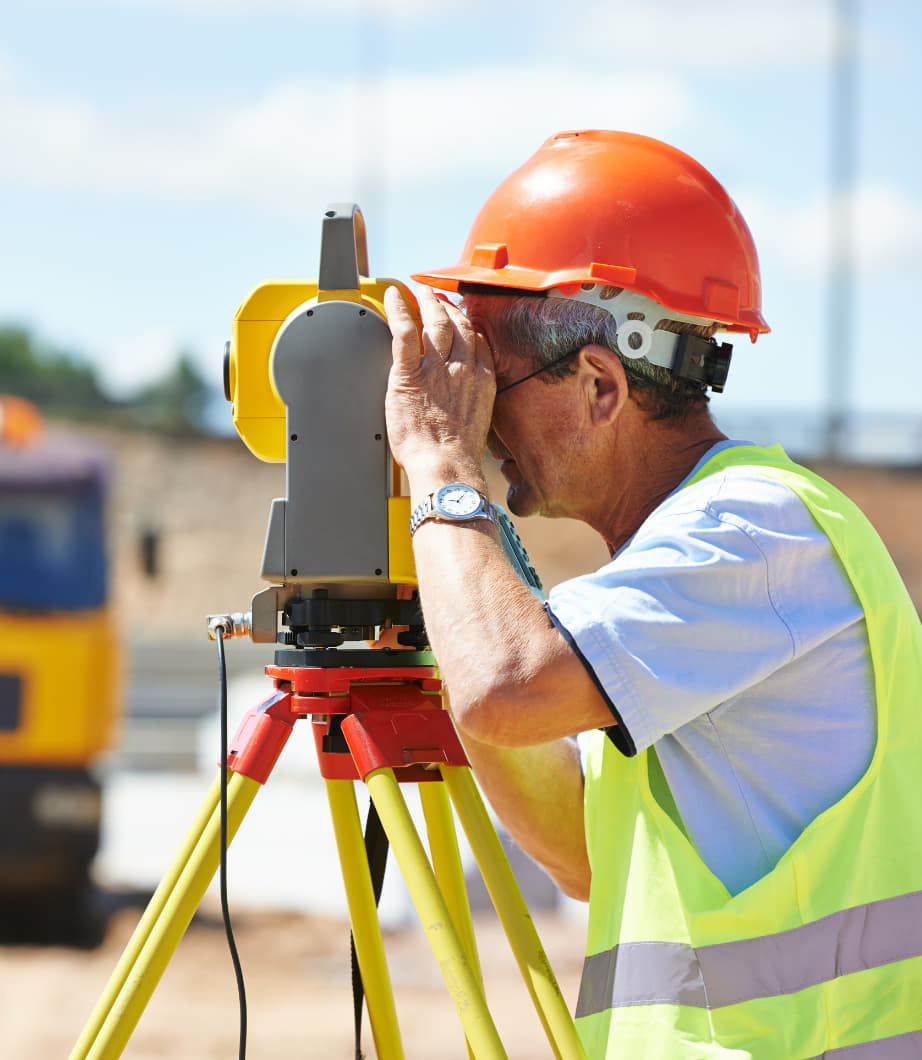 a surveyor using his tool