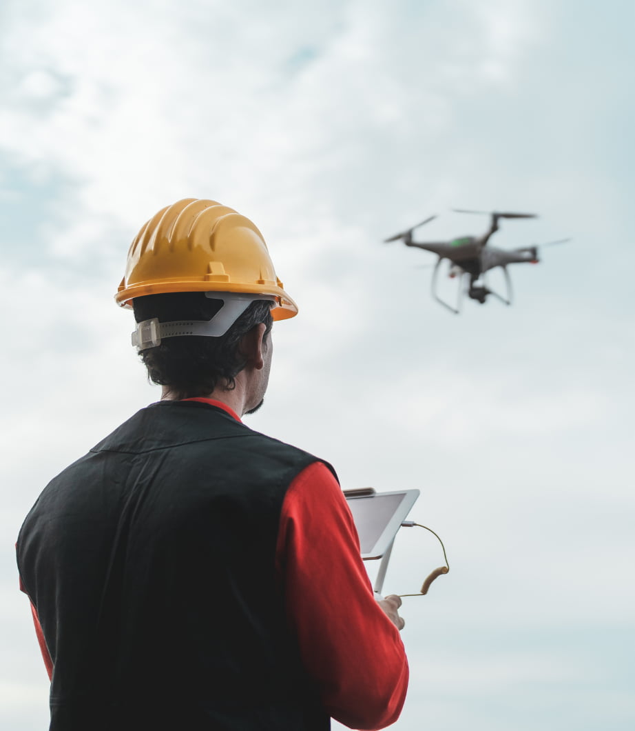 a surveyor using his tool