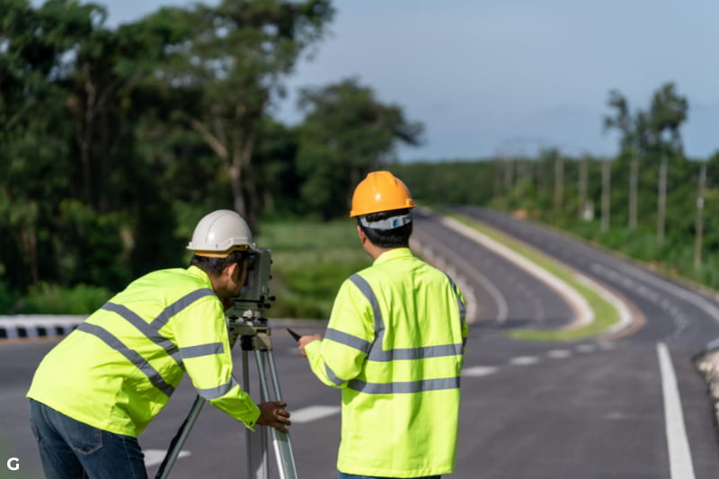 surveyors on a road