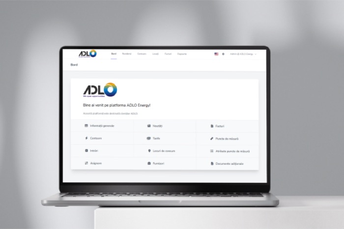 ADLO Energy platform dashboard on a laptop