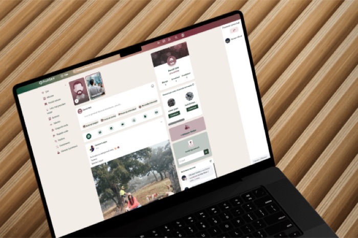 Huntex member profile page open on a laptop