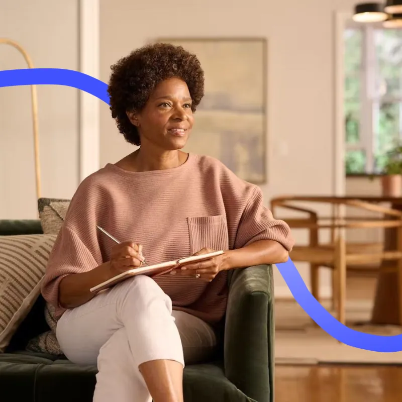 photo of a medical consultant sitting on a sofa