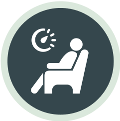  Icon depicting a person seated in a dental chair with a light or device near their head, indicating a dental procedure or examination.