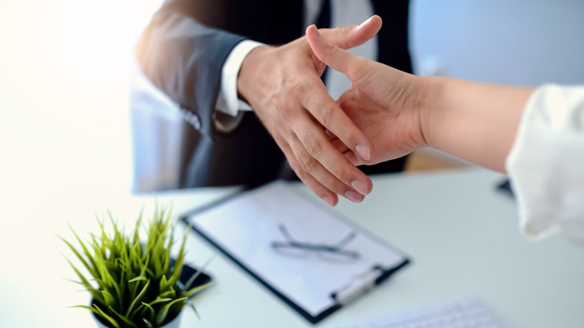 Handshake after a deal in Sales