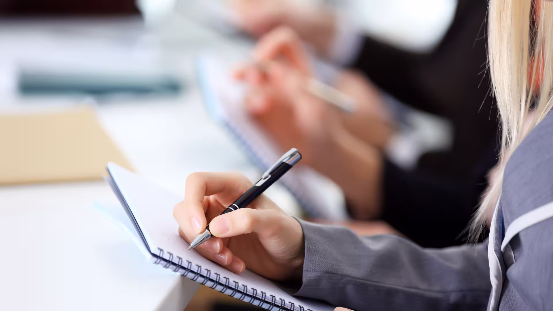 Woman makes Meeting Notes on Post-Its