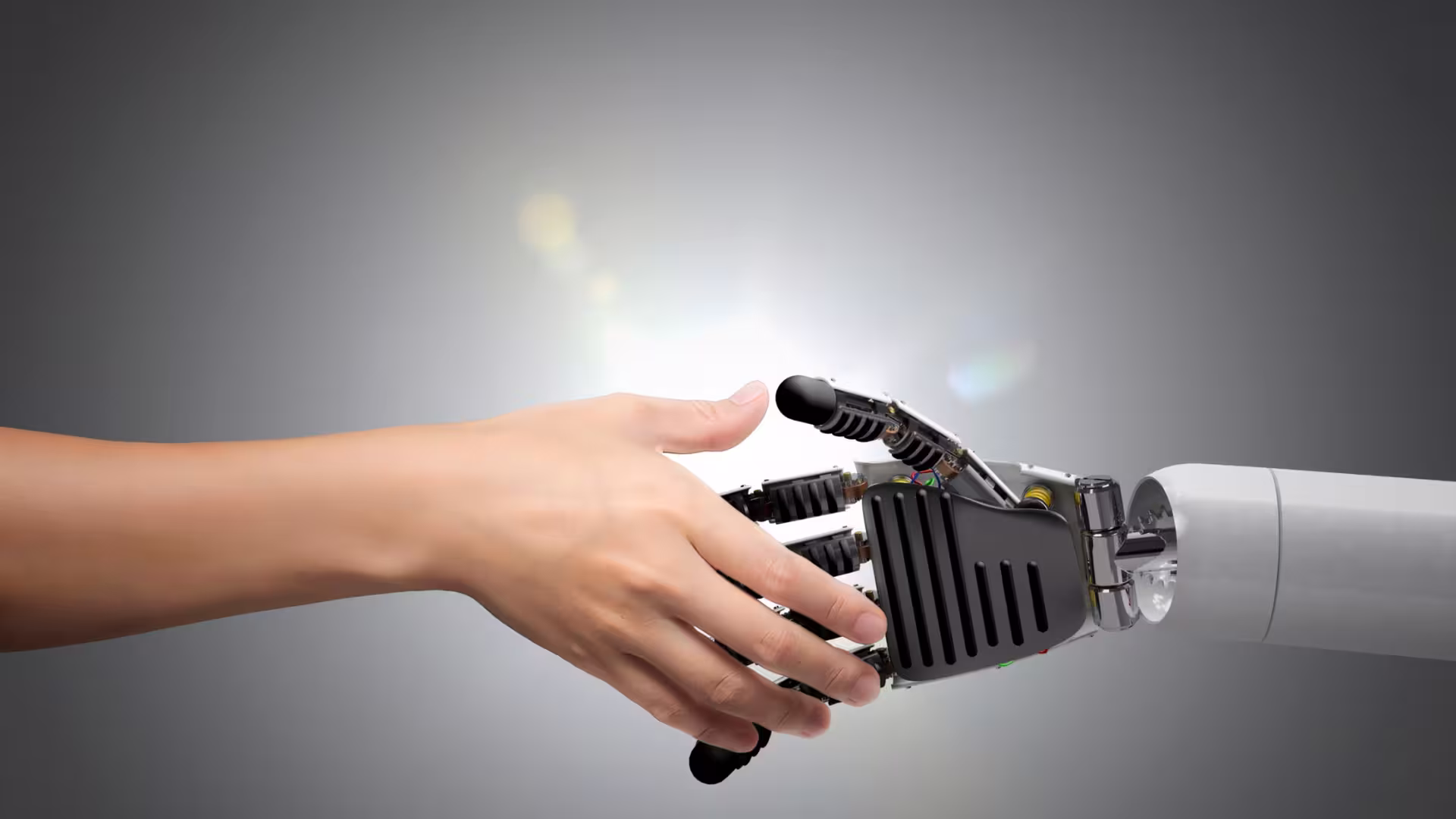 Person and machine shake hands
