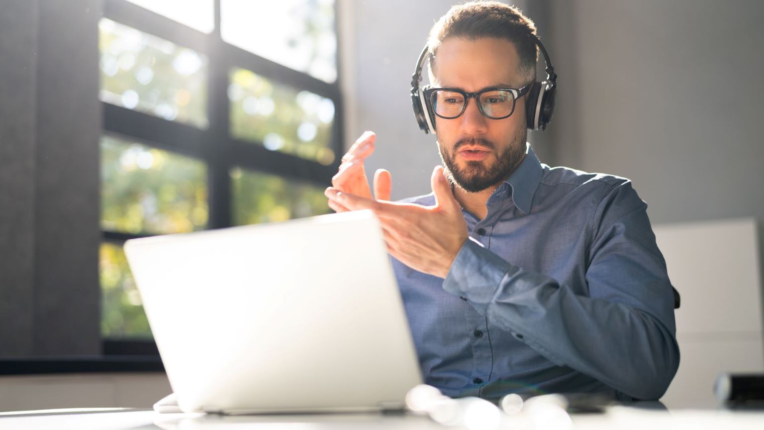 Guy in a webinar using zoom