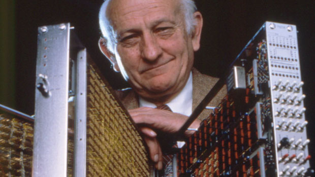John Cocke posing with the experimental 801, based on the Reduced Instruction Set Computer (RISC) architecture
