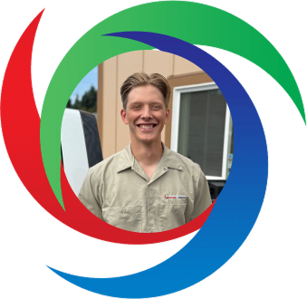 Smiling person in work uniform standing in front of colorful swirling logo