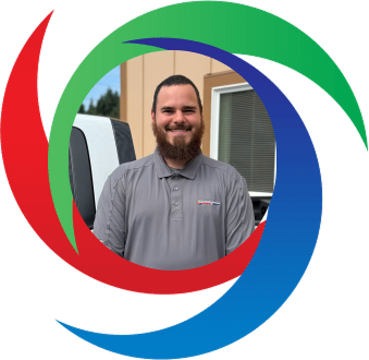 Smiling person in gray polo shirt in colorful swirling logo background