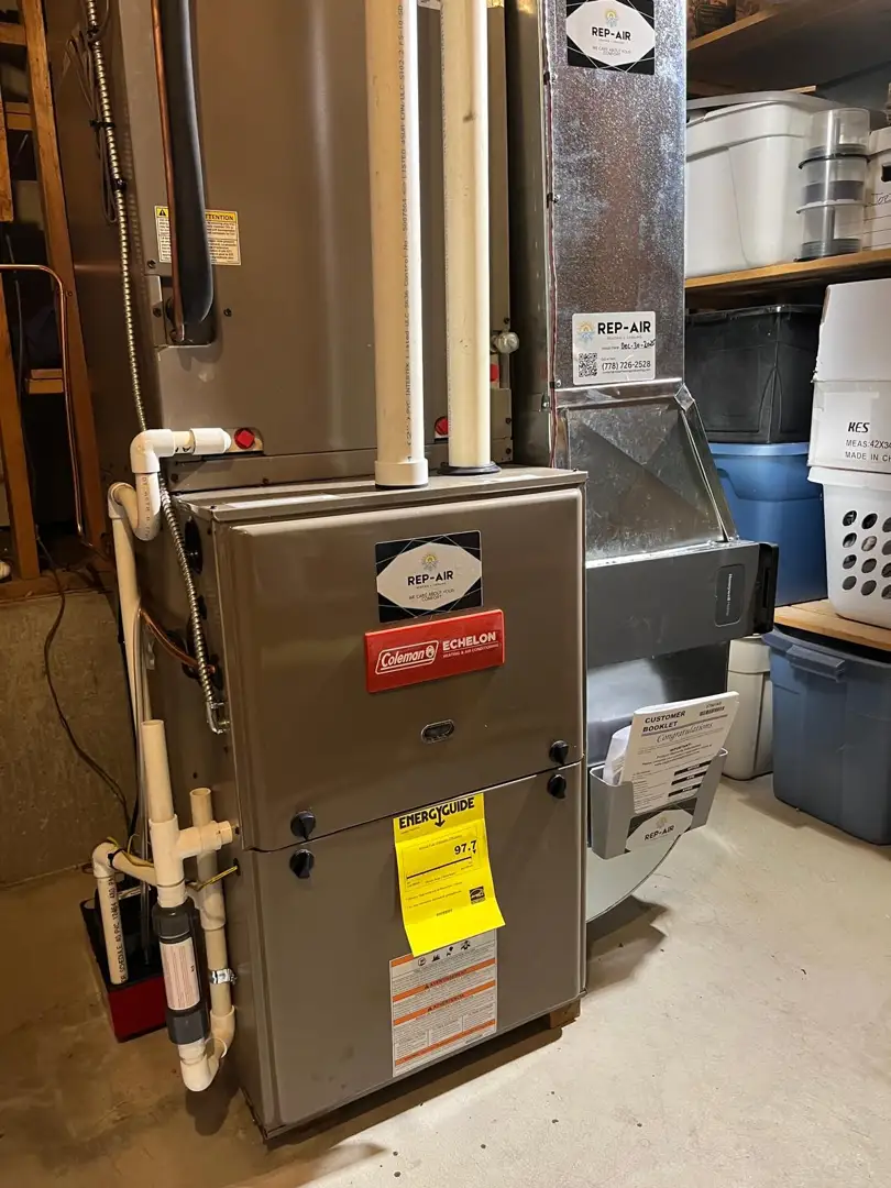 Technician installing a high-efficiency furnace in a modern residential basement - benefits of hiring a red seal certified Technician installing a high-efficiency furnace in a modern residential basement - benefits of hiring a red seal certified