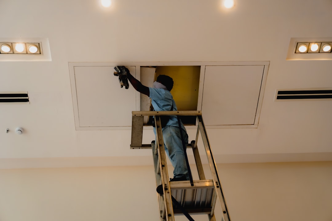 Technician performing professional indoor air testing in a residential home - how your hvac affects indoor air quality Technician performing professional indoor air testing in a residential home - how your hvac affects indoor air quality