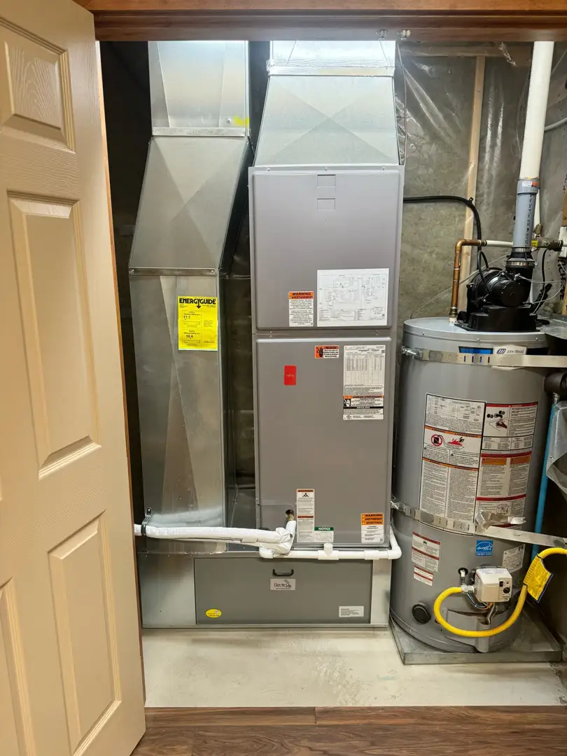 technician inspecting a boiler heat exchanger in a Mission, BC home - affordable boiler tune-up in Downtown Mission, BC technician inspecting a boiler heat exchanger in a Mission, BC home - affordable boiler tune-up in Downtown Mission, BC
