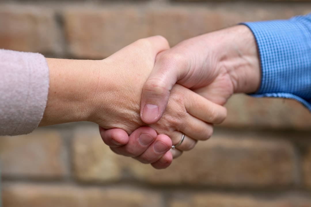 homeowner shaking hands with a friendly technician - certified heating technician in maple ridge, bc