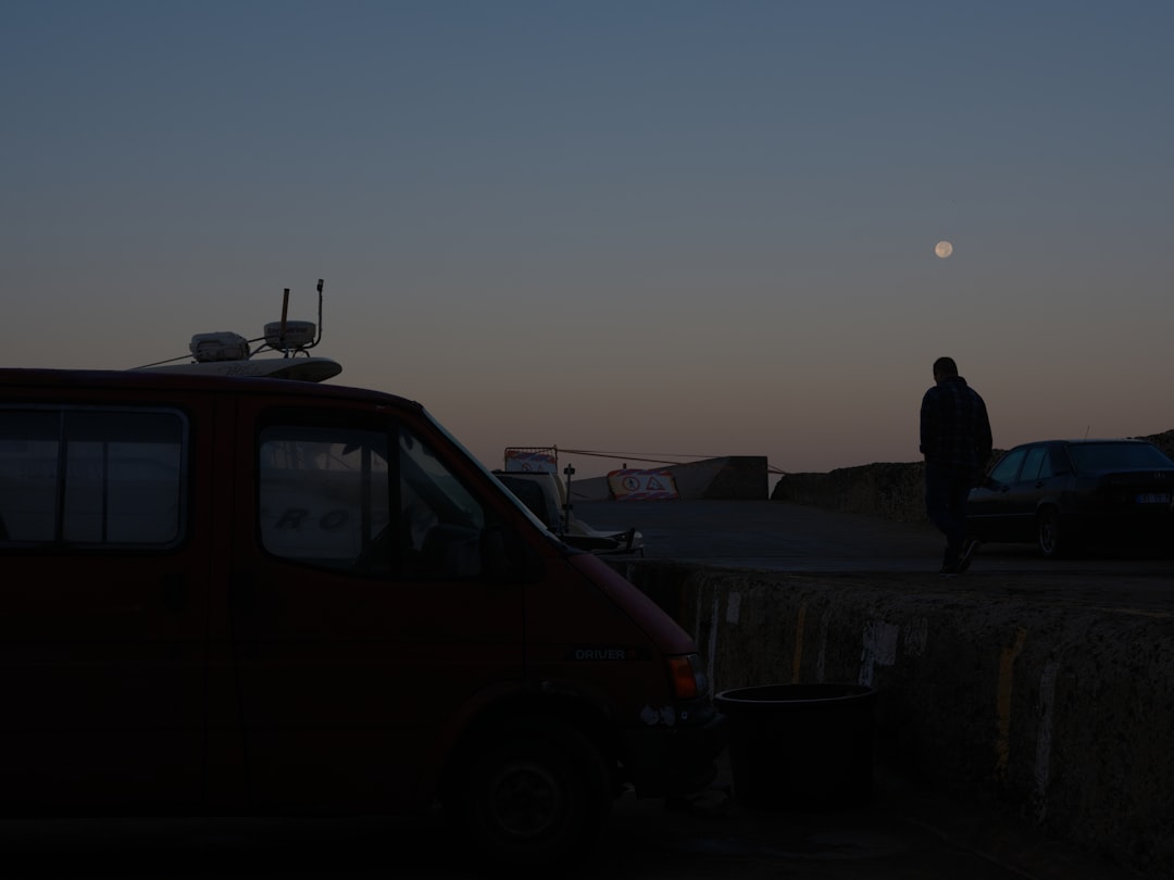 HVAC technician arriving at home at dusk - 24/7 heat pump installation langley