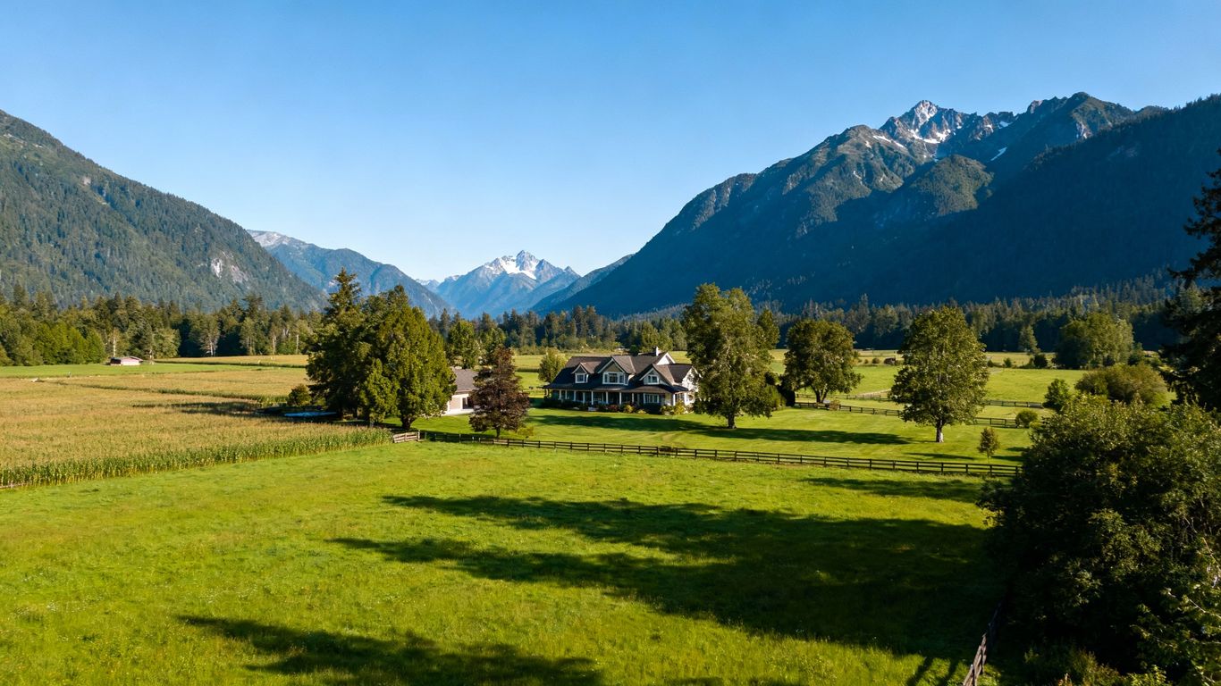 Pemberton Valley farm estate with mountains and pastures.