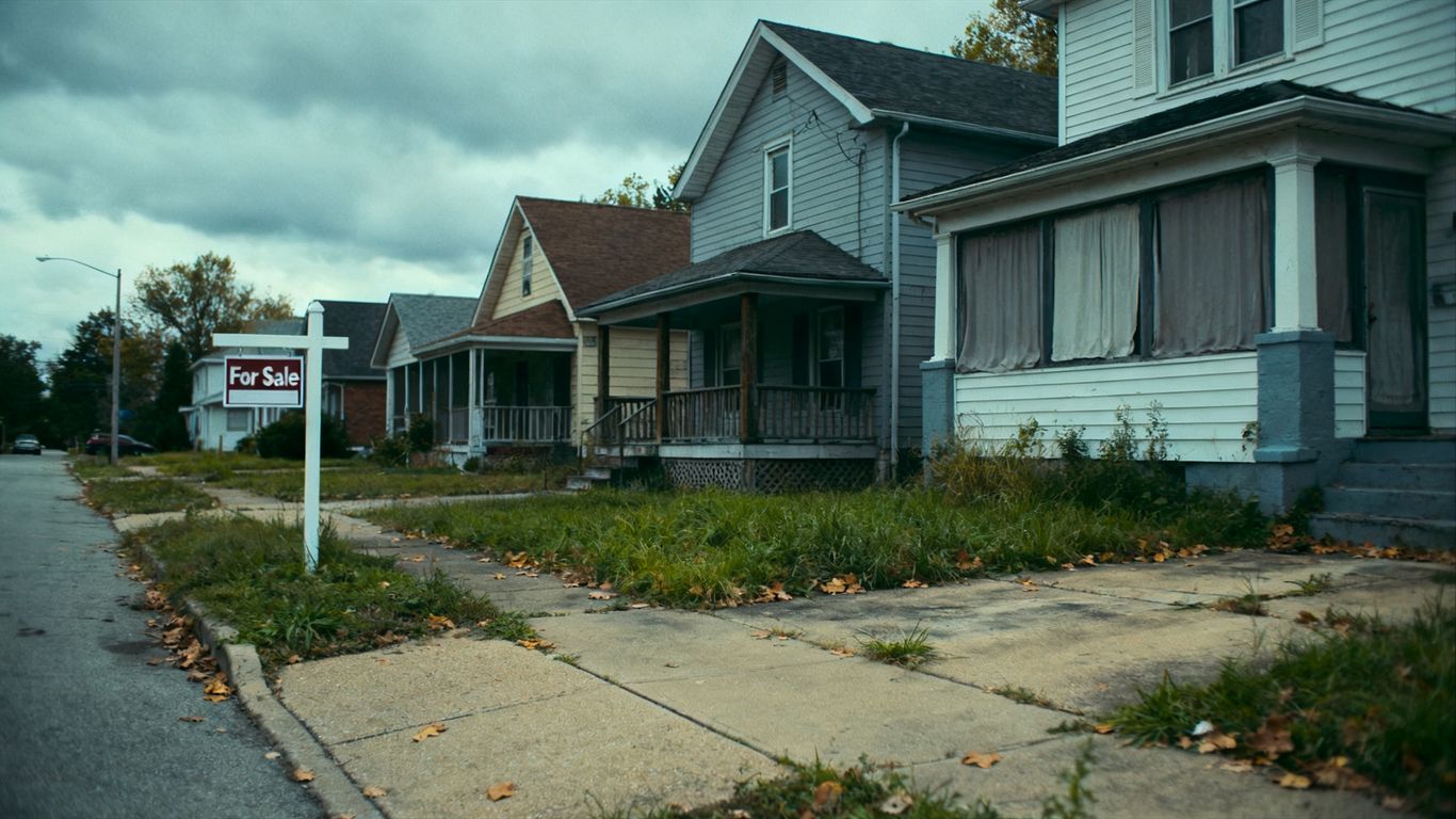 Houses for sale in a suburban neighborhood with low buyer activity.