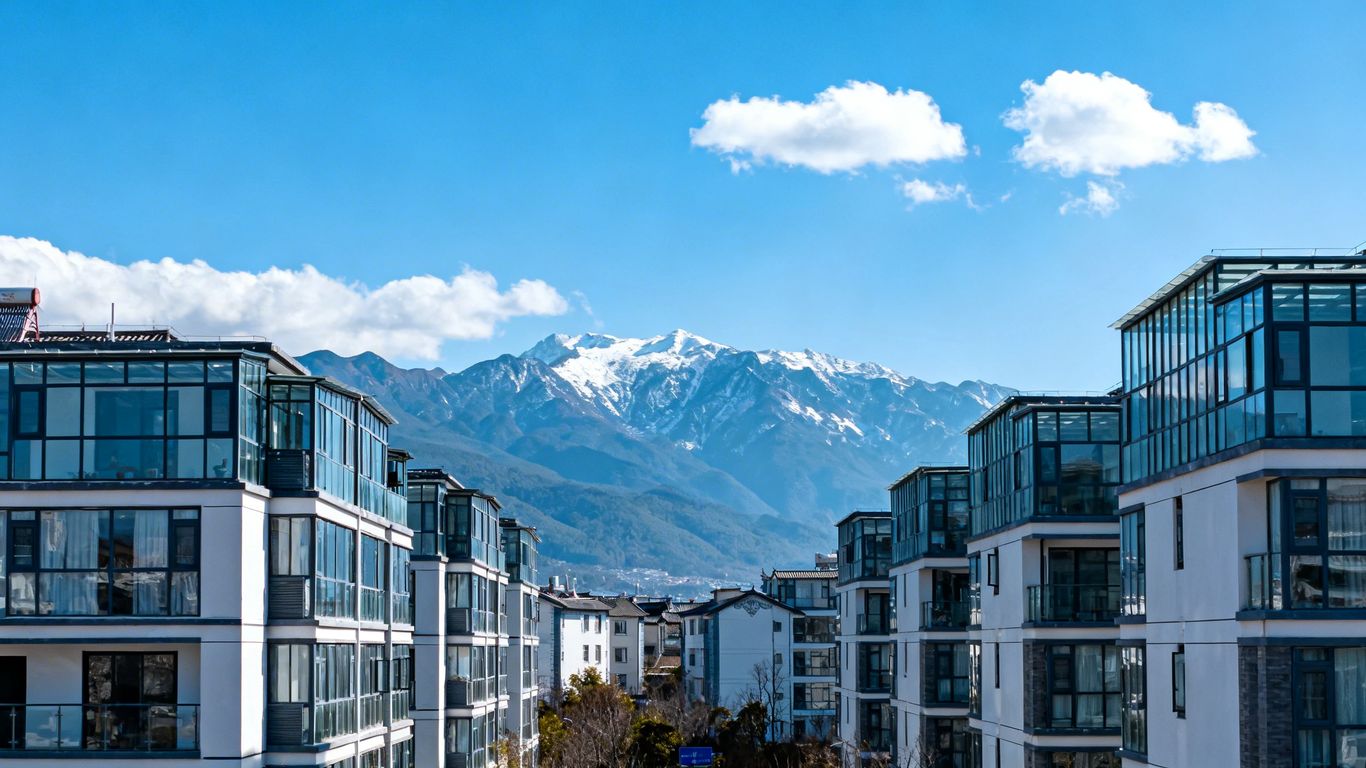 Vancouver cityscape with residential buildings and mountains.