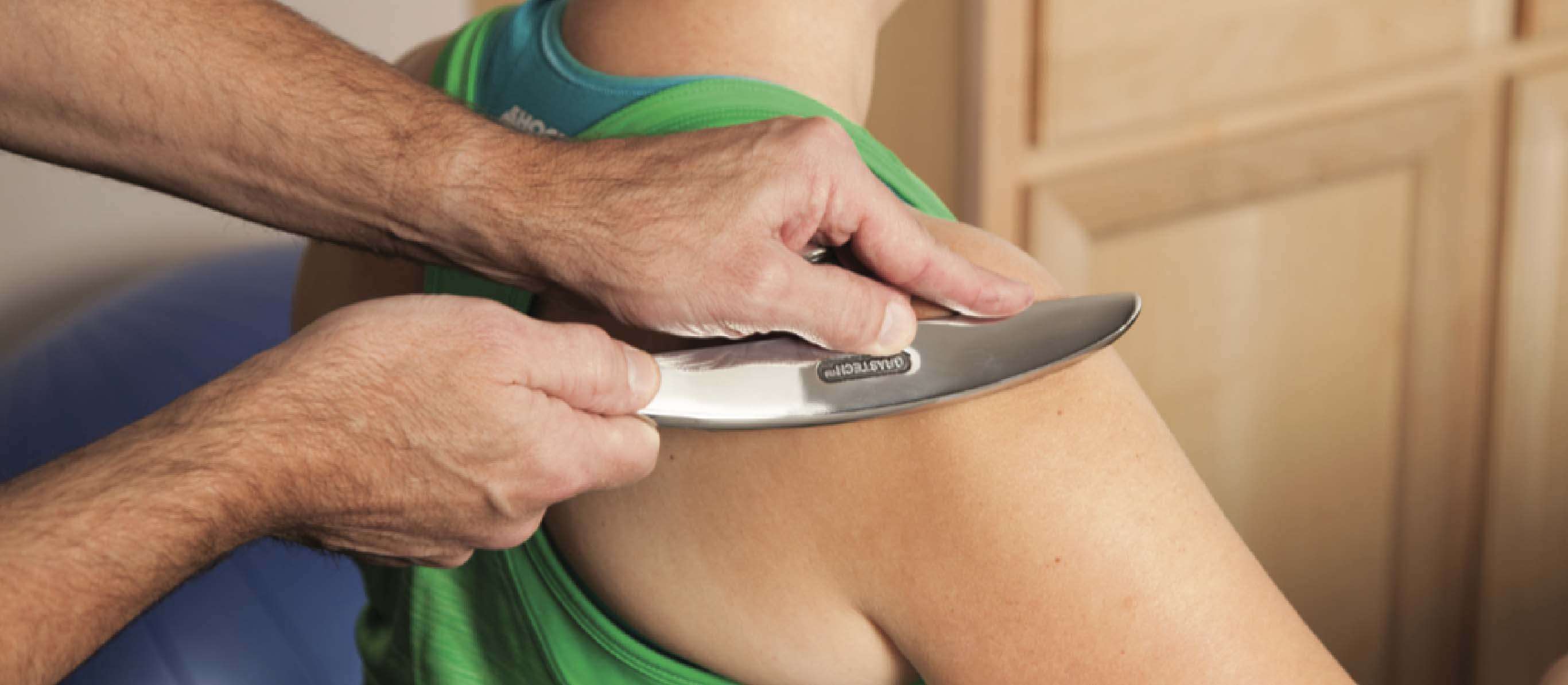 patient at acriveedge spine & sport being treated for muscle pain