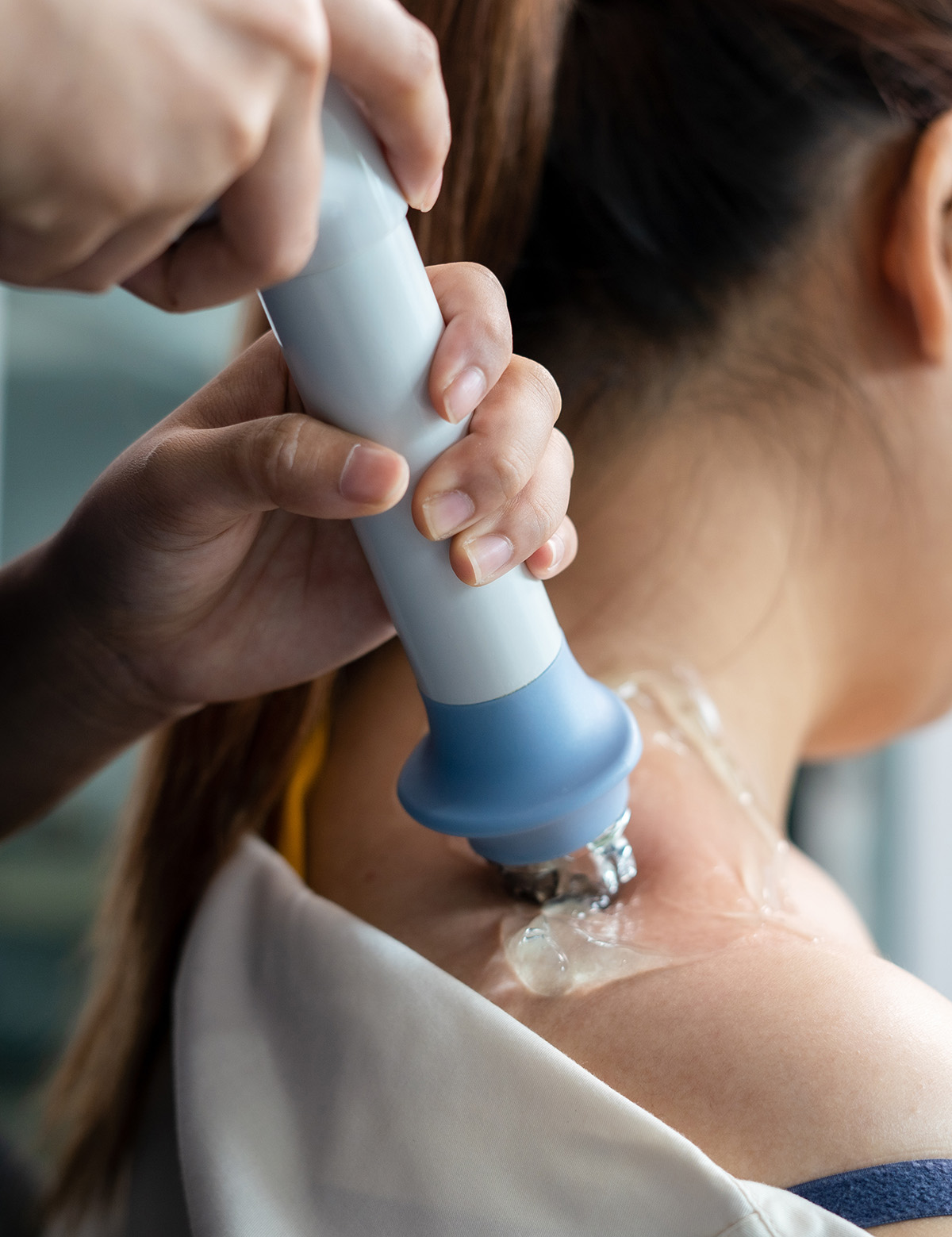 Patient being treated for lateral epicondylitis with shockwave therapy at ActiveEdge Spine & Sport in Ottawa.