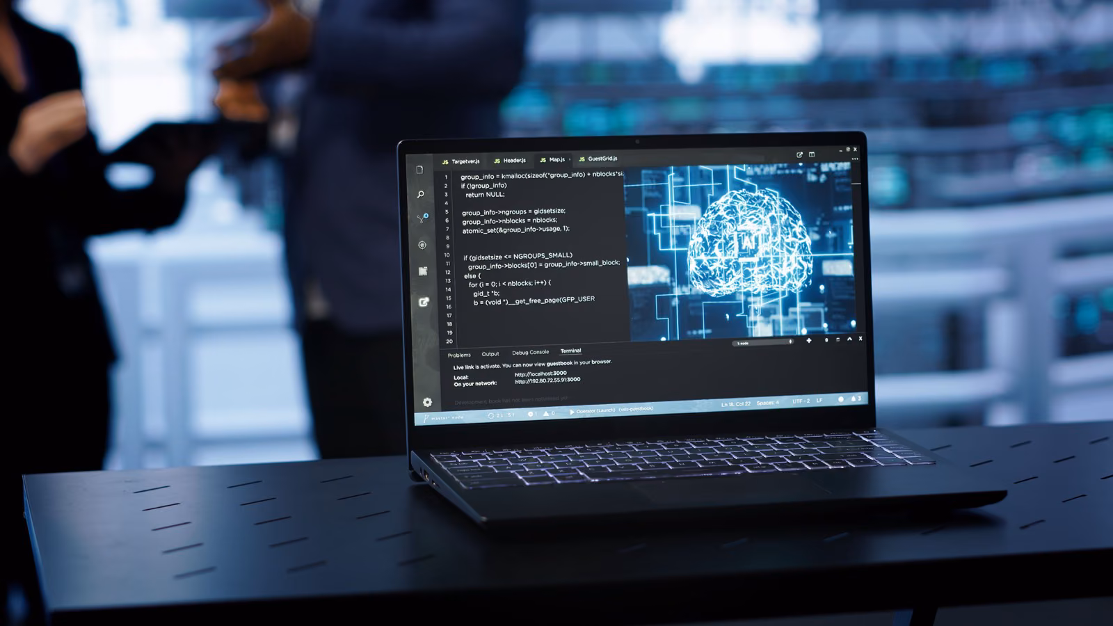 Laptop displaying AI recommendation code and a neural network visualization in a dark office