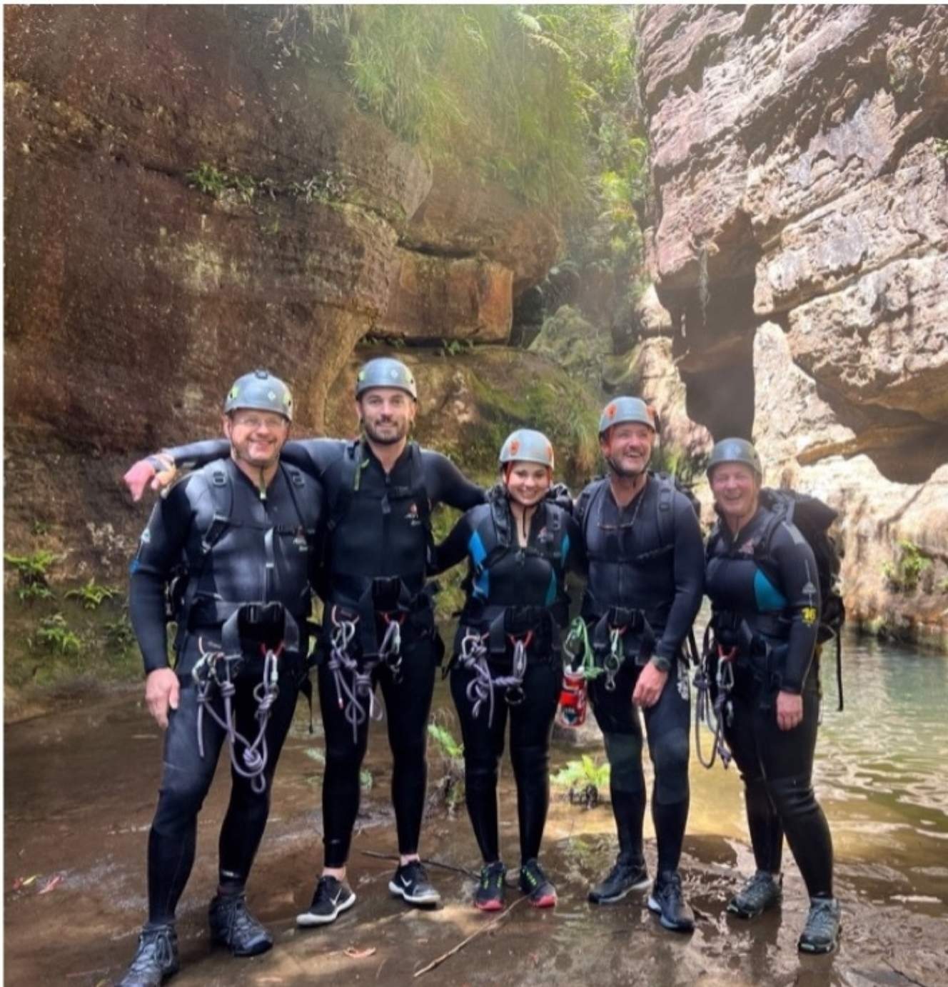 Team participating in canyoning during a team cohesion activity in the Blue Mountains near Sydney