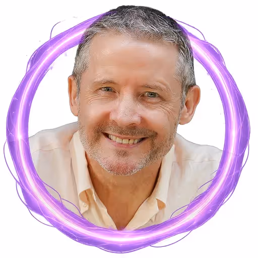 Smiling middle-aged man with gray hair and beard inside a glowing purple ring.
