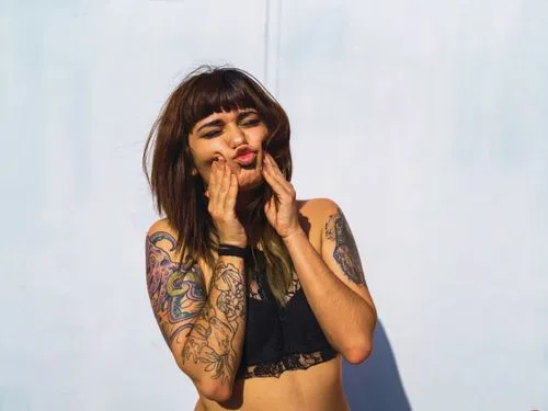 young attractive caucasian female with tattoos