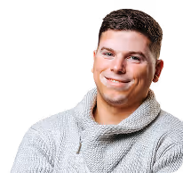 Smiling man wearing a light gray sweater with arms crossed against a black background.
