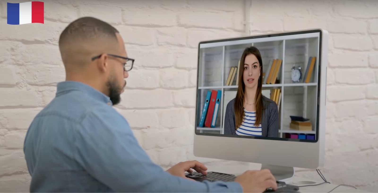 An employee watches a video training
