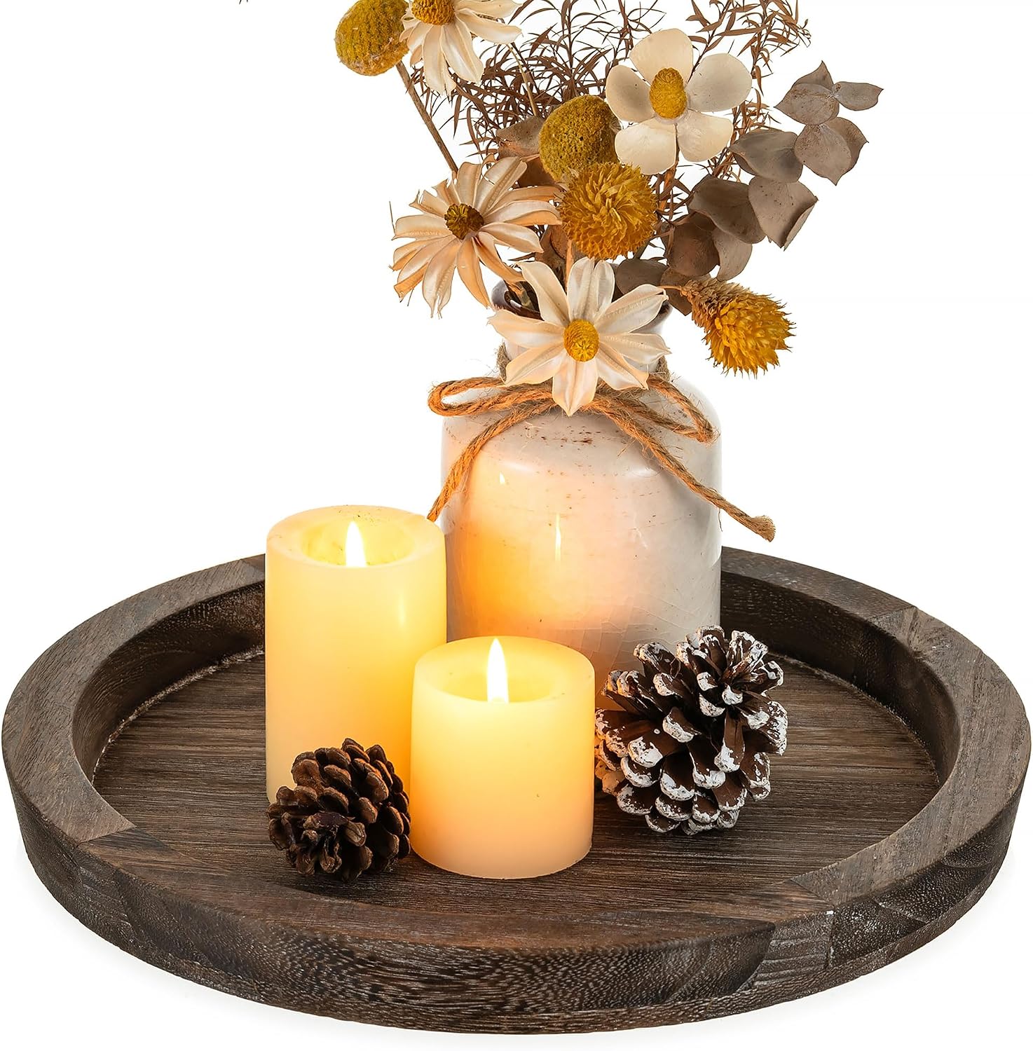 The image shows a product photo used to test ad hooks. It features a wooden tray with three lit candles of different sizes, a white vase containing dried flowers and leaves, and two pinecones. The context mentions using this product photo to test three ad hooks: the product-first hook with video [1.mp4] and the detail hook with video [2.mp4].
