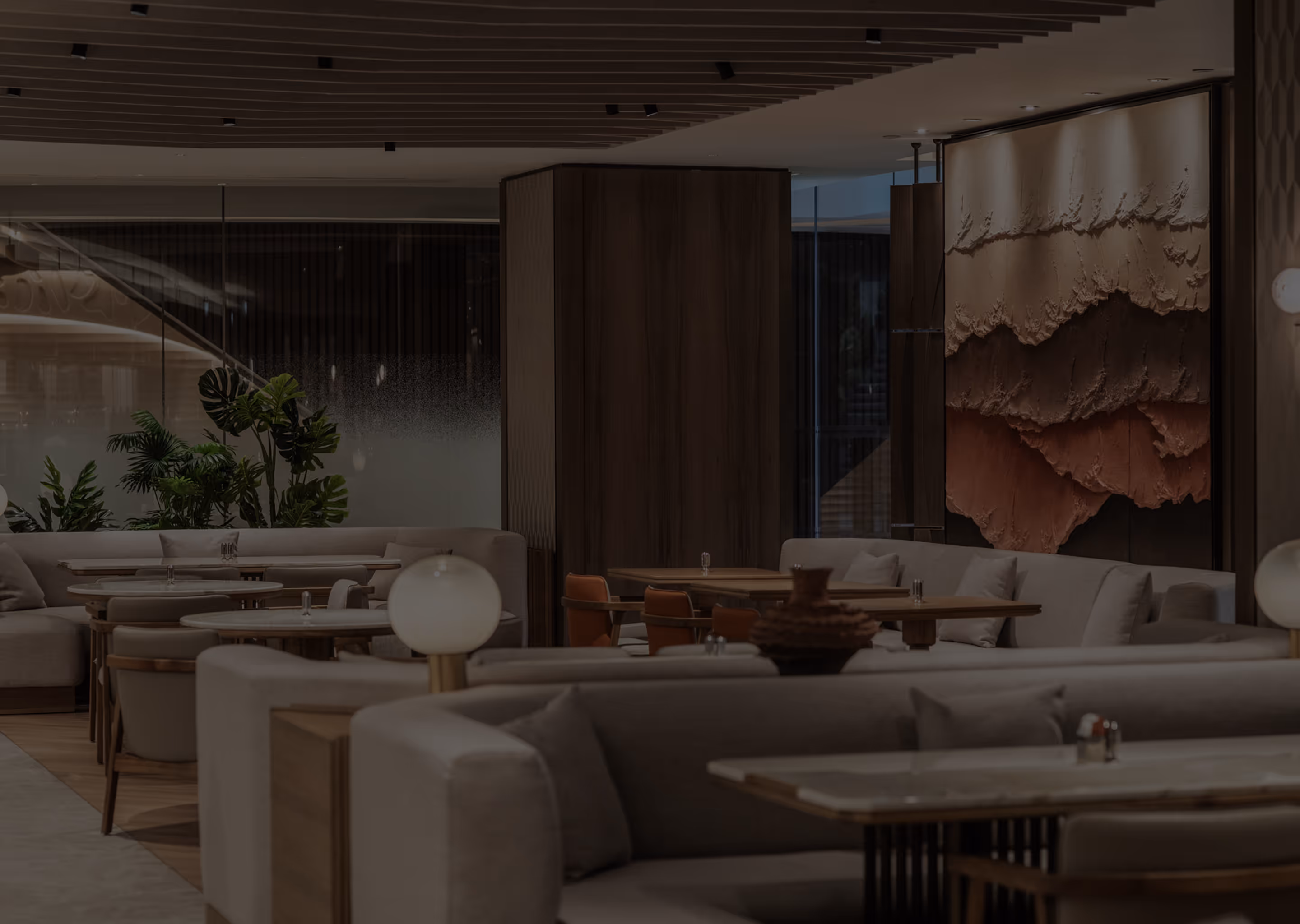 Modern restaurant interior designed by I II Concept, featuring warm wood tones, textured wall art, and elegant seating arrangement.