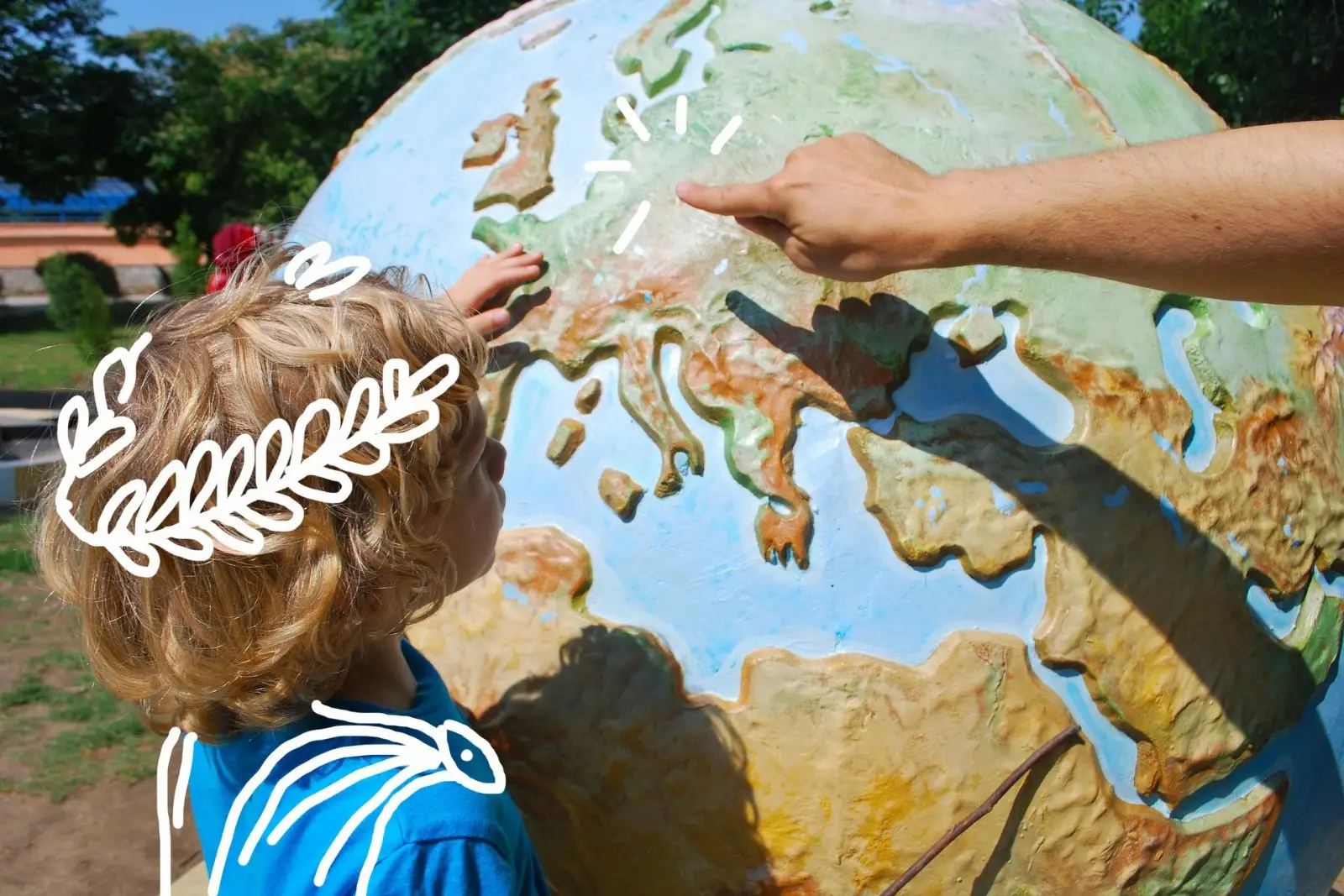 Un enfant qui regarde un globe terrestre 
