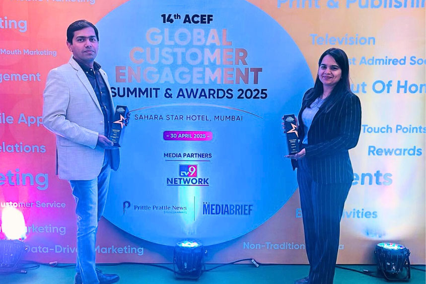 Two individuals holding awards standing in front of a backdrop for the 14th ACEF Global Customer Engagement Summit & Awards 2025 at Sahara Star Hotel, Mumbai.