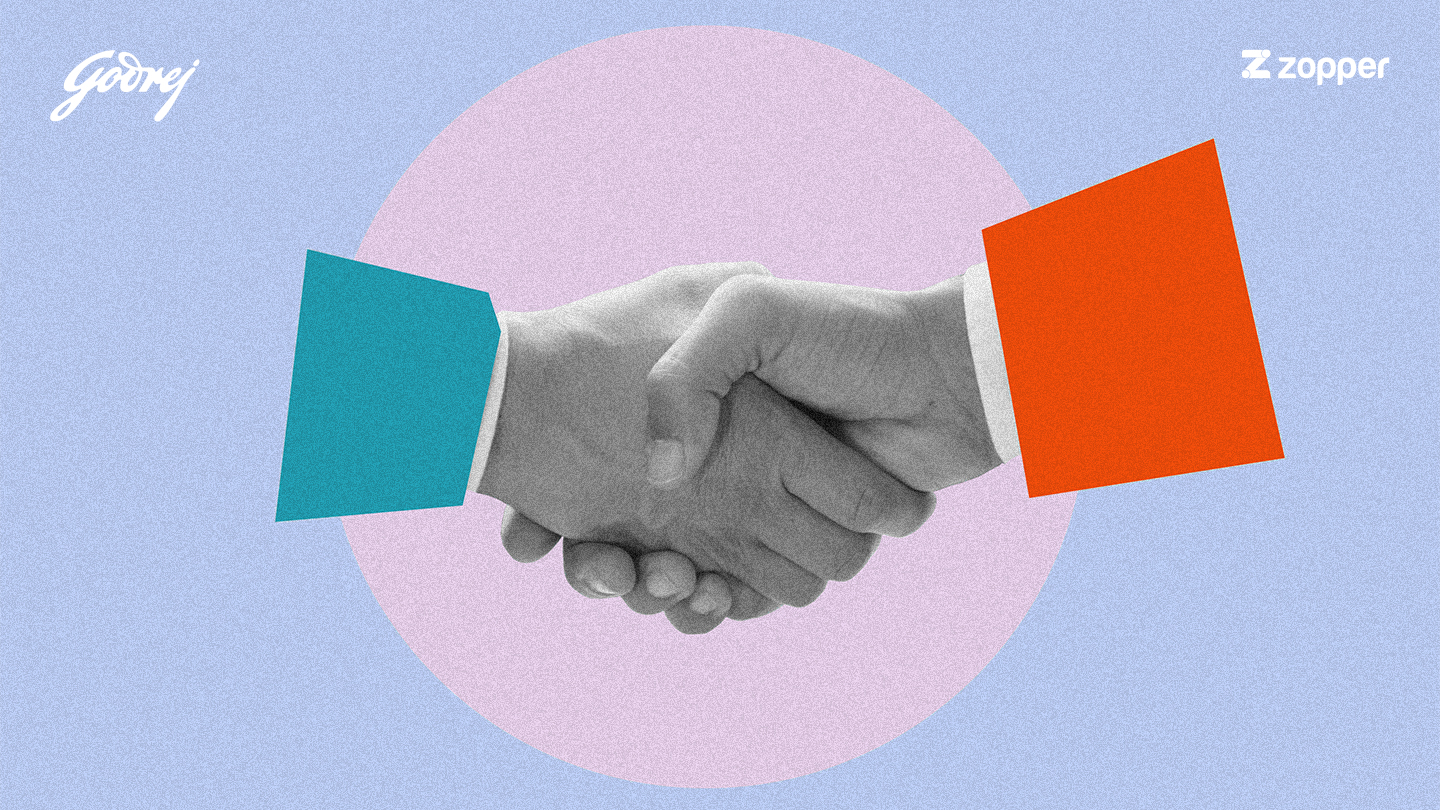 Two hands shaking, symbolizing partnership, with stylized blue and orange sleeves and logos of Godrej and Zopper on a light purple and blue background.