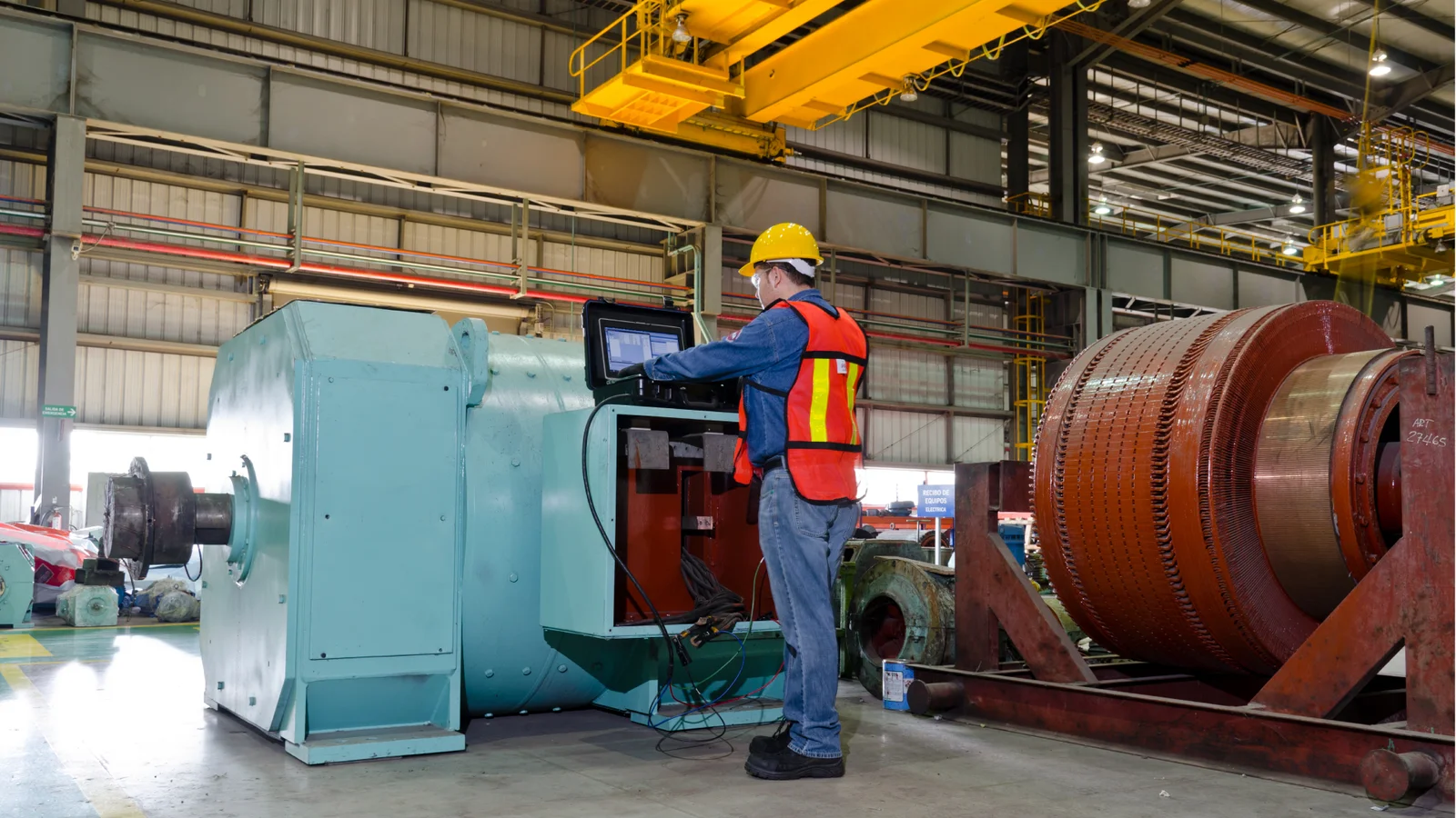 Technician inspecting a large electric motor
