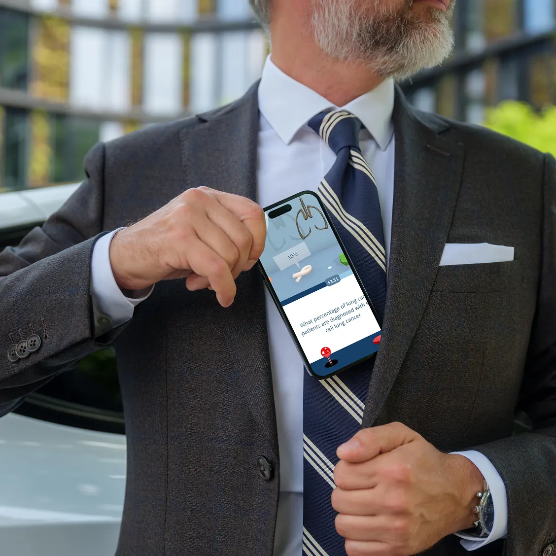 Man holding a phone with a Daiichi game interface opened on it