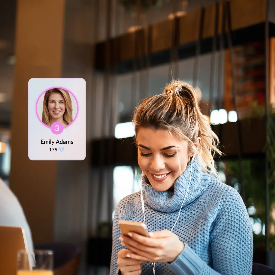 Woman playing a game on her phone with the headphones on