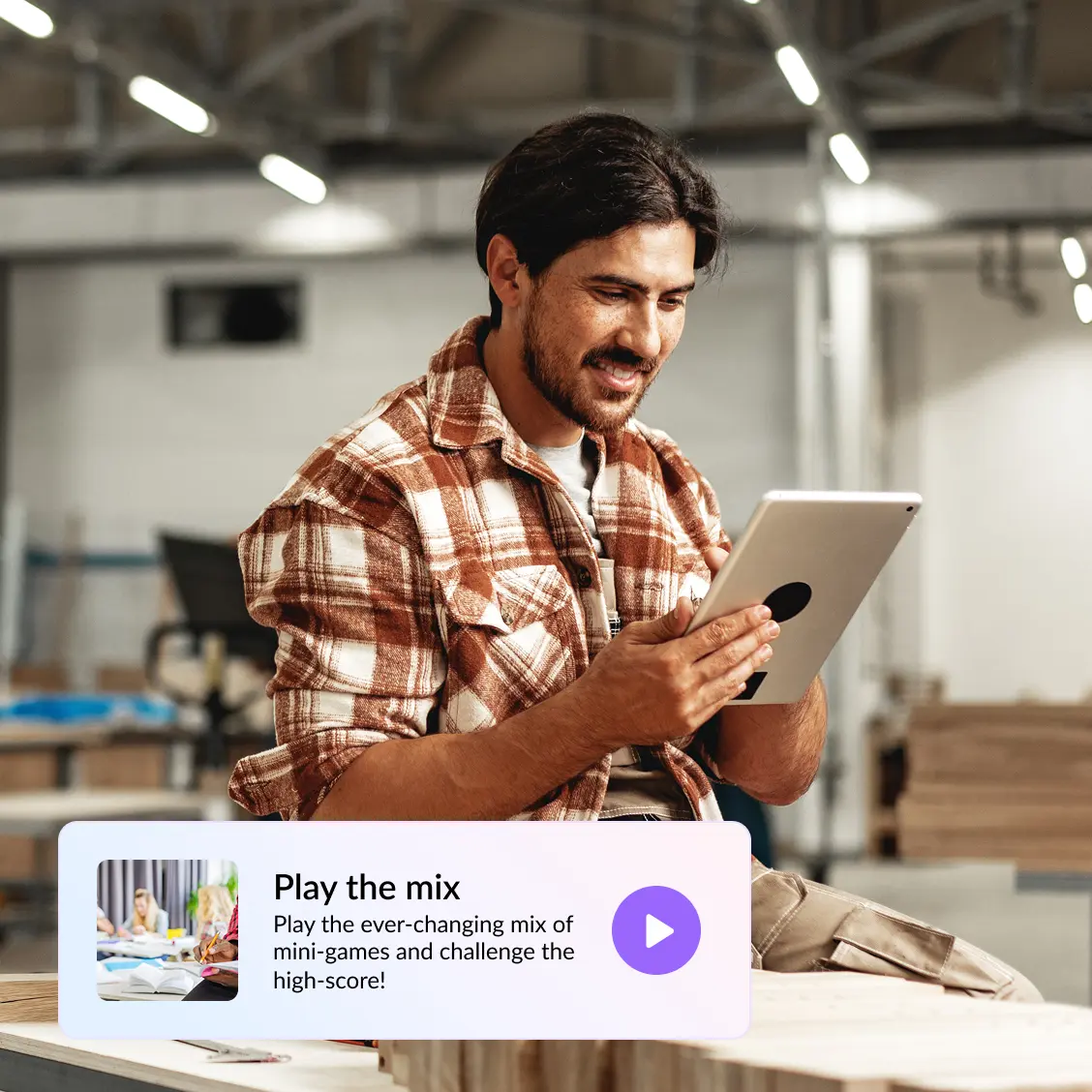 Man using a laptop at his work and smiling