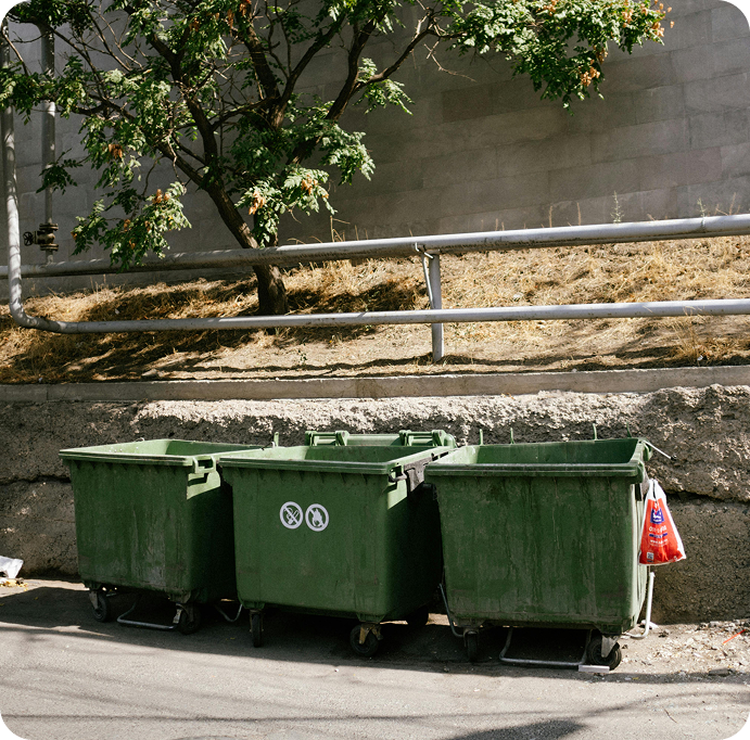 Three green bins next to each other 