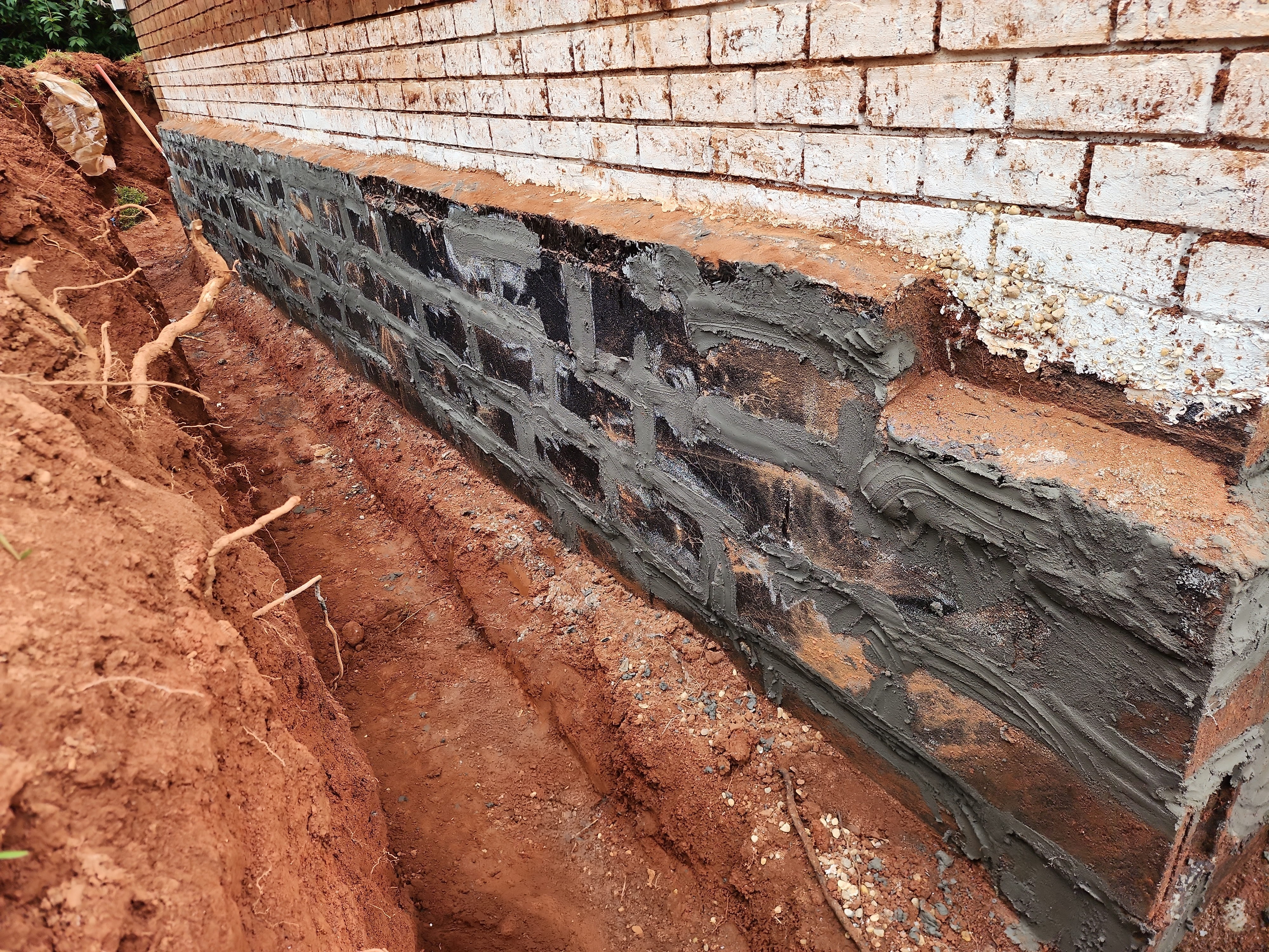 Foundation repair work in progress on slab