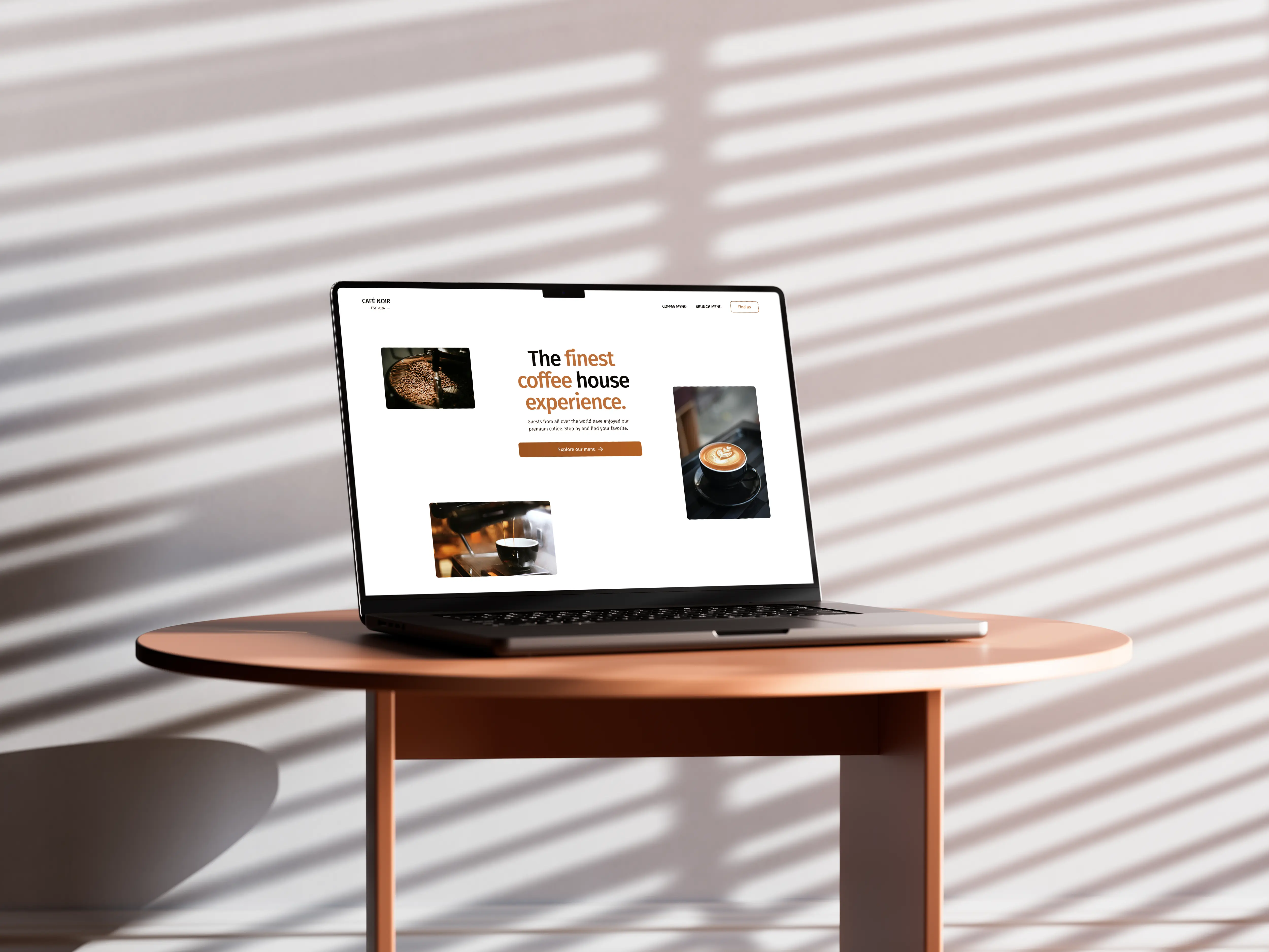 A laptop is standing on top of a wooden coffee table. The lid is open and it shows Cafe Noirs website. The website consists of the top header including the navigation links. Below is the hero section. The hero section has a centered heading that reads "The finest coffee house experience.". Below is a paragraph with the text "Guests from all over the world have enjoyed our premium coffee. Stop by and find your favorite.". Below is a button and the primary call to action, to explore the coffee menu. On both sides of the text are images that are positioned asymmetrically, showing coffee beans, coffee being poured into a cup and a served coffee cup.