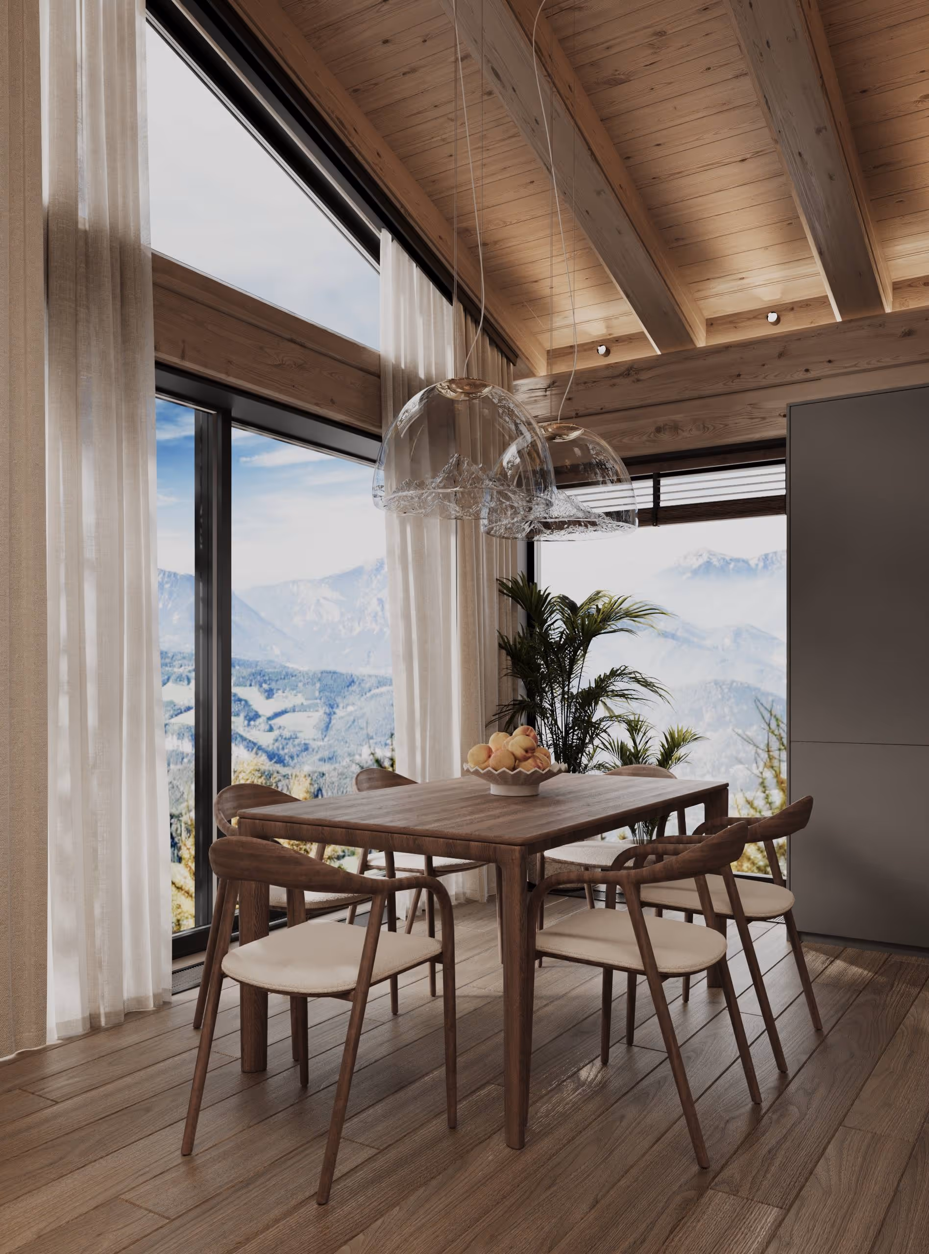 Essbereich im Alpen Traum Chalet – Holztisch, Panoramafenster mit Bergblick und Naturdeko.