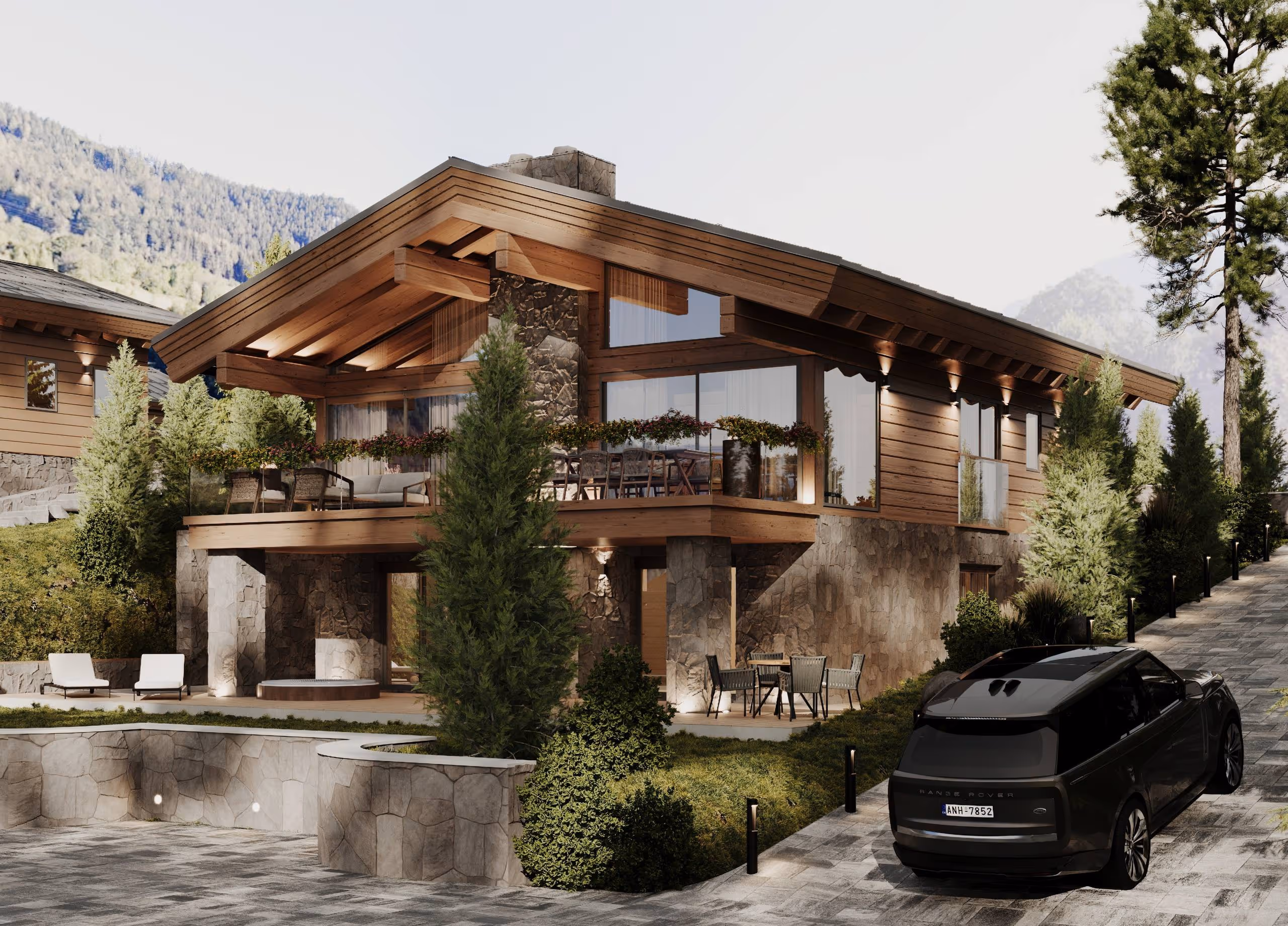 Alpen Traum Chalet – moderne Holz- und Steinarchitektur mit Balkon, großen Fenstern und alpiner Landschaft.