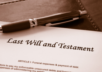 A pen atop a last will and testament, as advised by Marsons Solicitors