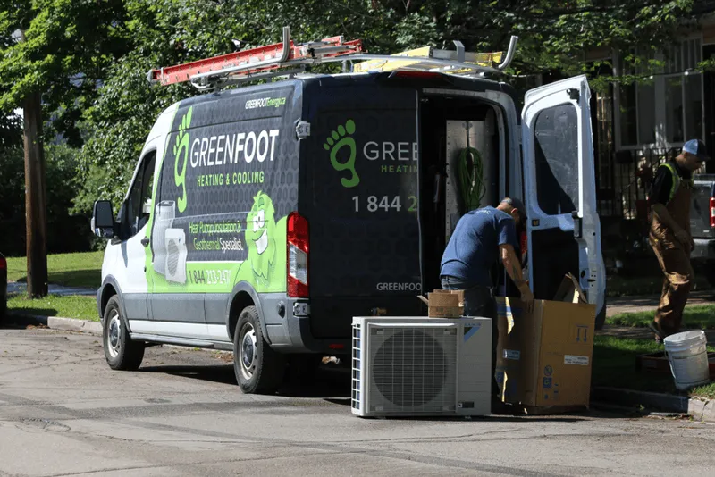 a man loading a greenfoot energy van