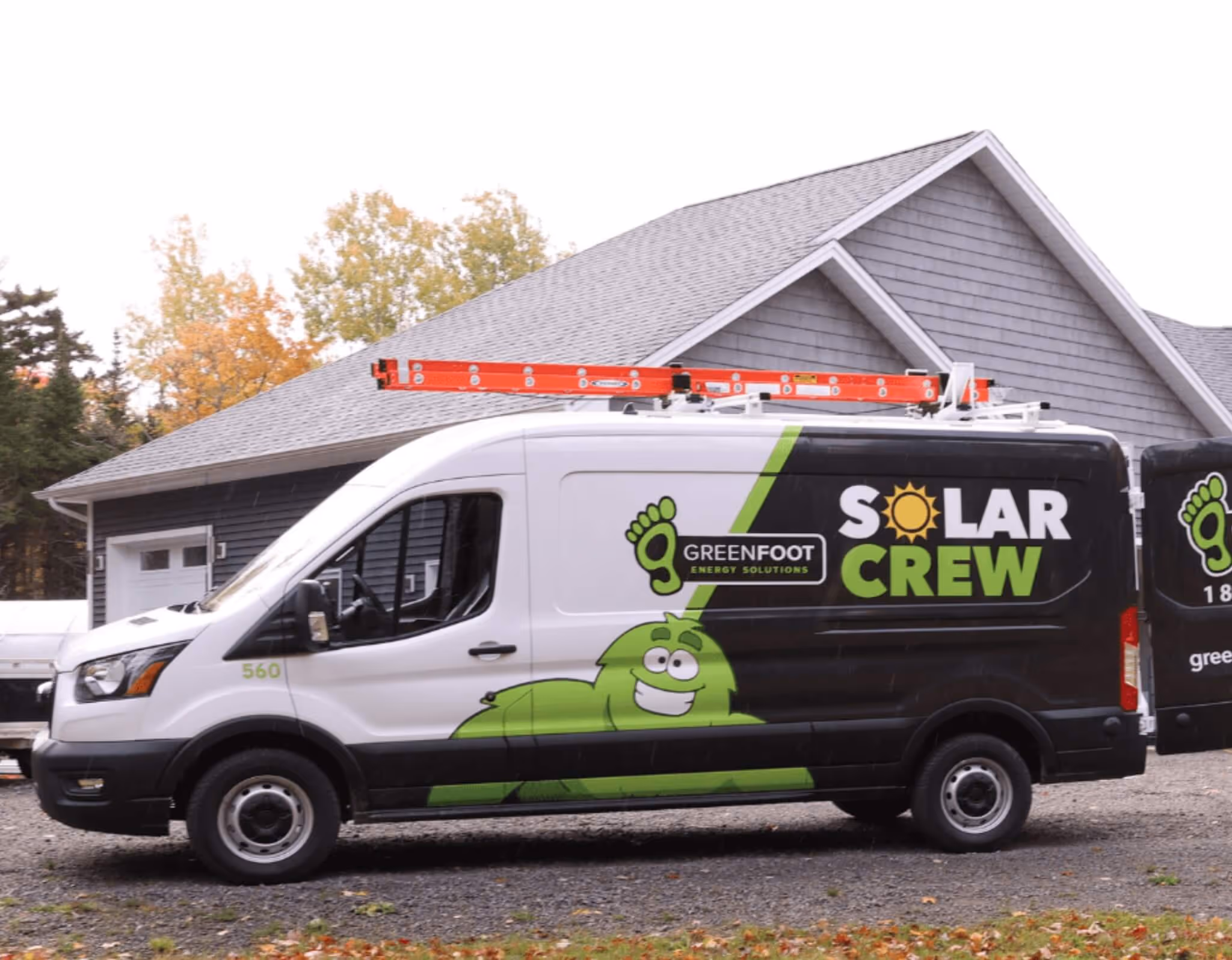 a white van with a ladder on top