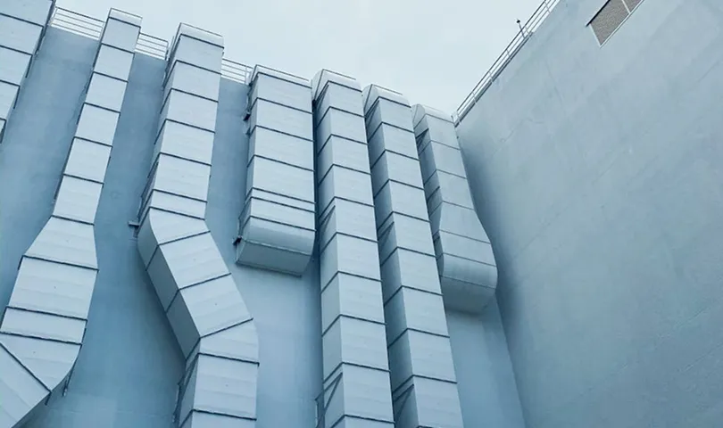 A tall building with a clock on the side of it.
